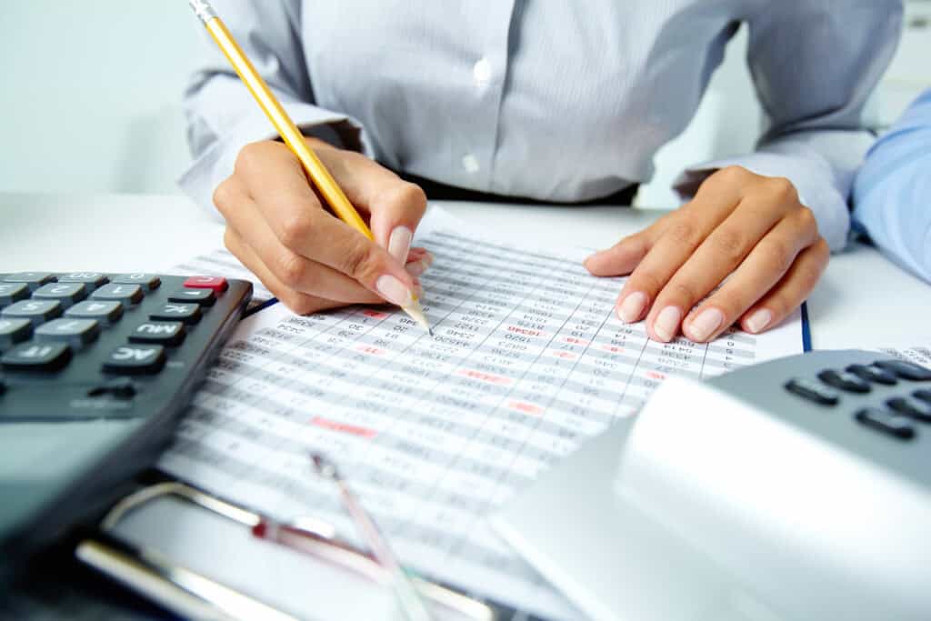 IRS layoffs | Woman checking numbers